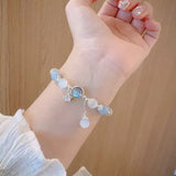 Bracelet imitation œil de chat cristal de papillon