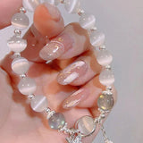 Bracelet imitation œil de chat cristal de papillon