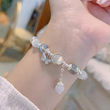 Bracelet imitation œil de chat cristal de papillon