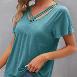 T-shirt à découpes de couleur unie