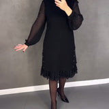 Robe élégante à pois et manches longues