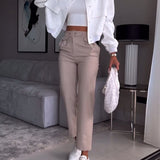 Pantalon de costume décontracté à poches de couleur unie