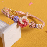 Bracelet avec noeud de fleurs de pêcher