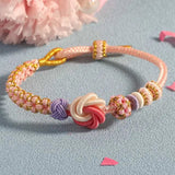 Bracelet avec noeud de fleurs de pêcher