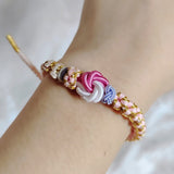 Bracelet avec noeud de fleurs de pêcher