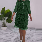 Robe élégante superposée à imprimé pois