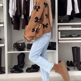 Cardigan à lacets avec perles et nœud