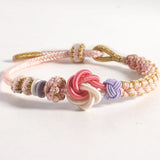 Bracelet avec noeud de fleurs de pêcher
