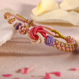 Bracelet avec noeud de fleurs de pêcher