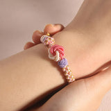 Bracelet avec noeud de fleurs de pêcher