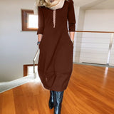 Robe élégante de couleur unie avec poche et col rond