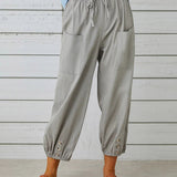 Pantalon taille haute bouton neuf points