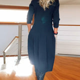 Robe élégante de couleur unie avec poche et col rond