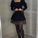Robe élégante à manches bouffantes et imprimé léopard