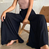 Pantalon taille haute de couleur unie
