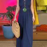 Robe longue slim élégante sans manches
