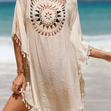 Couverture de plage avec pompons