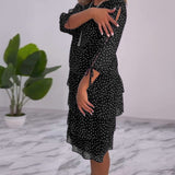 Robe élégante superposée à imprimé pois