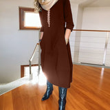 Robe élégante de couleur unie avec poche et col rond