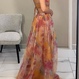 Robe d’été fluide à imprimé fleuri – silhouette féminine et légère