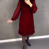 Robe élégante à pois et manches longues