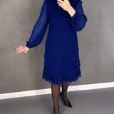 Robe élégante à pois et manches longues