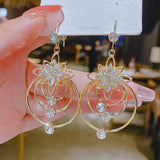 Boucles d'oreilles trois créoles lotus en cristal