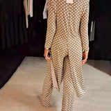 Costume élégant fendu à pois