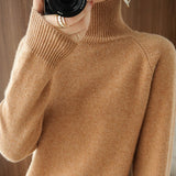 Pull simple à manches longues et col haut de couleur unie