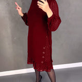 Robe élégante à pois et manches longues