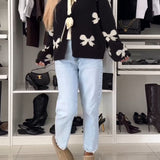 Cardigan à lacets avec perles et nœud