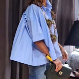 Chemise décontractée à poches plissées de couleur unie
