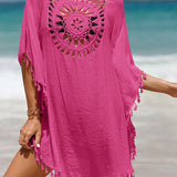 Couverture de plage avec pompons