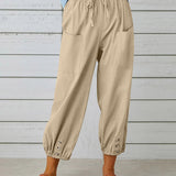 Pantalon taille haute bouton neuf points