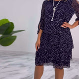 Robe élégante superposée à imprimé pois