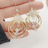 Boucles d'oreilles trois créoles lotus en cristal