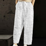 Pantalon décontracté de couleur unie à lacets brodés de fleurs