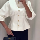 Manteau élégant à simple boutonnage de couleur unie