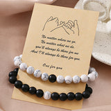 Ensemble de bracelets pour couple tissés en perles noires et blanches