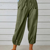 Pantalon taille haute bouton neuf points
