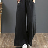Pantalon large taille haute de couleur unie