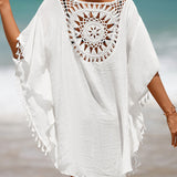 Couverture de plage avec pompons