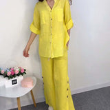 Ensemble chemisier et pantalon large en dentelle avec poche boutonnée et couleur unie