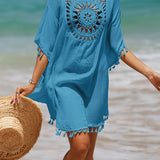 Couverture de plage avec pompons