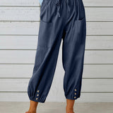 Pantalon taille haute bouton neuf points