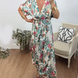 Robe élégante torsadée à col en V et imprimé botanique