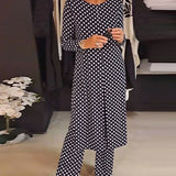 Costume élégant fendu à pois