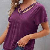 T-shirt à découpes de couleur unie