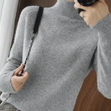 Pull simple à manches longues et col haut de couleur unie