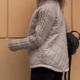 Manteau zippé à col haut de couleur unie